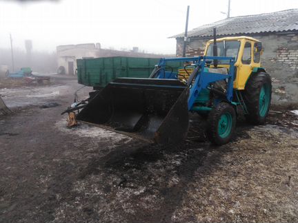 Чистка снега вывоз мусора работа ковшом трактора