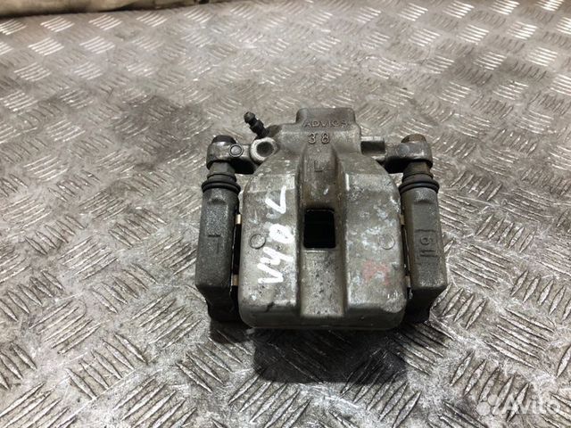 Суппорт тормозной задний левый Toyota Camry V40
